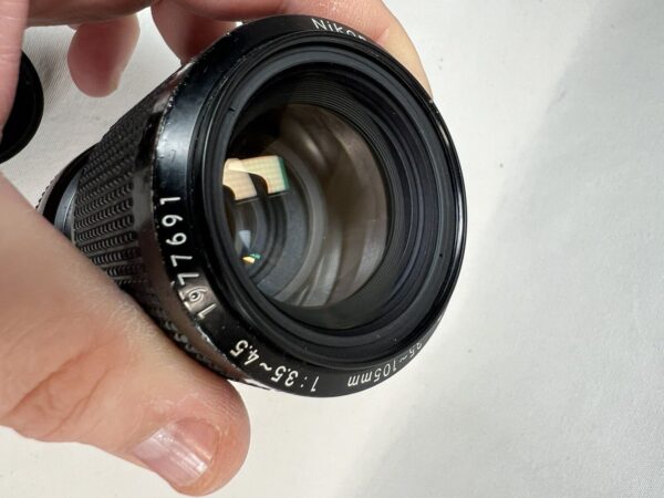 Nikon Zoom-Nikkor 35-105 mm f/3.5-4.5 + Filtro UV L1bc Nikkon - immagine 21
